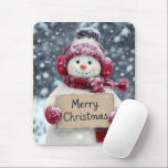 Snowman With a Merry Christmas Sign Mouse Pad<br><div class="desc">A cheerful snowman,  wearing red earmuffs,  cap,  and a matching scarf,  holds a sign that reads "Merry Christmas" amid a snowy background</div>