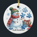Snowman's Puzzle Wonderland Ceramic Tree Decoration<br><div class="desc">Snowmen have their own unique talents; one such snowman is in wonderment while attempting to assemble puzzle pieces. This holiday tree ornament features a whimsical scene of a snowman with twig arms,  dressed to impress with puzzle pieces around him. A little holiday humour on this Puzzle Wonderland ornament.</div>