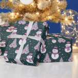 Snowmen Christmas Trees Snowflakes Green Christmas Wrapping Paper<br><div class="desc">Introducing our Super Cute Snowy Wonderland Christmas Wrapping Paper, designed to bring the magic of the holiday season to life. This modern wrapping paper features a delightful green Christmas background, setting the stage for a charming winter scene. Adorning this festive backdrop are adorable snowmen, twinkling Christmas ornaments, intricate snowflakes, and...</div>