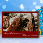 Snowy Christmas Photo Holiday Card<br><div class="desc">Capture the joy and warmth of the holiday season with the Snowy Christmas Photo Holiday Card. Featuring a charming scene of a couple in winter clothing, laughing together outside a snow-covered store, this card is a perfect way to share your holiday spirit. The words "Merry Christmas 2024" and "From the...</div>