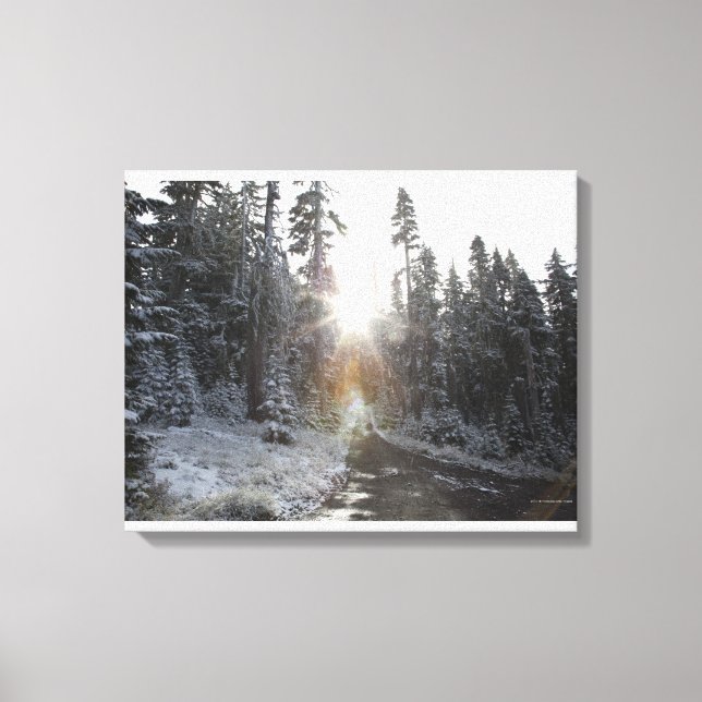 Snowy dirt road going into the sun canvas print (Front)