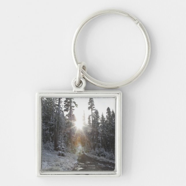 Snowy dirt road going into the sun key ring (Front)
