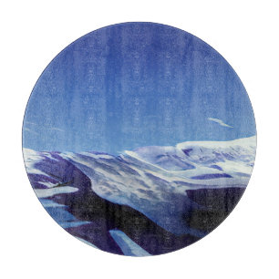Snowy hills, winter panorama cutting board