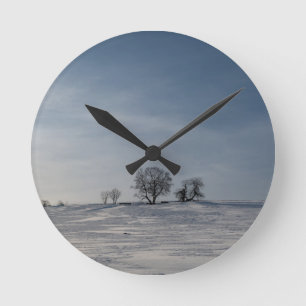 Snowy landscape round clock