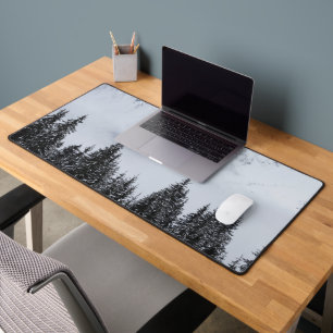Snowy mountains and spruce forest desk mat
