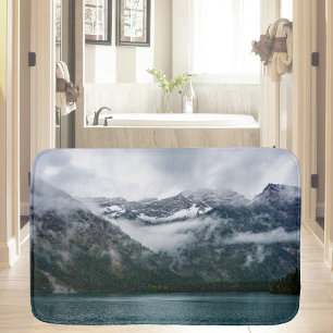 Snowy mountains in the fog at Plansee lake Bath Mat