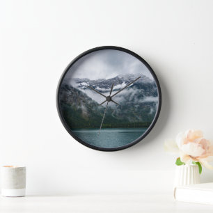 Snowy mountains in the fog clock