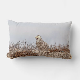 Snowy owl sitting on the beach lumbar cushion