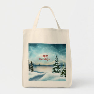Snowy pine trees near a lake tote bag