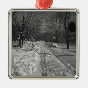 Snowy residential street metal tree decoration