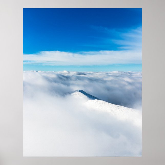 Snowy winter mountain wrapped in clouds poster (Front)