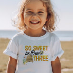So Sweet to Bee Three 3rd Birthday Toddler T-Shirt<br><div class="desc">Personalised 3rd birthday t-shirt with "So sweet to bee three" on the front and "Happ-Bee birthday [name]" on the back. The bee themed design features fun bee puns in yellow and black lettering, decorated with bumblebees, a beehive, country flowers and dripping honey. For co-ordinating invitations and party decor, please browse...</div>