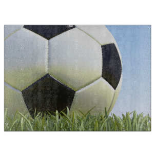 Soccer ball on grass. cutting board