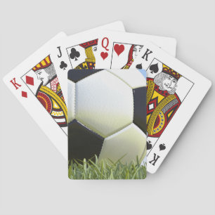 Soccer ball on grass. playing cards