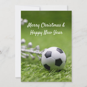 Soccer ball with Christmas decoration on green Ho Holiday Card