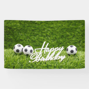 Soccer ball with Happy Birthday sign on green
