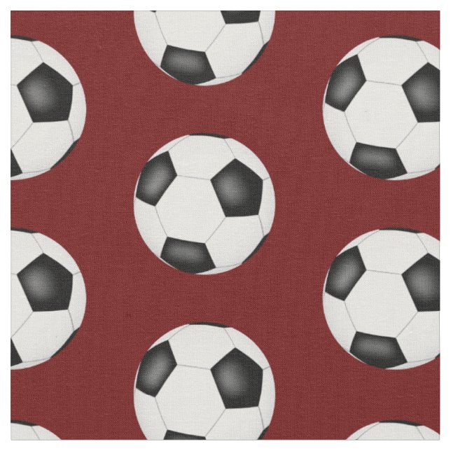 soccer balls on dark red sports pattern fabric (Close Up)