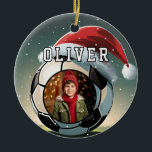 Soccer Football Ball Santa Hat Christmas Photo  Ceramic Tree Decoration<br><div class="desc">Soccer Football Ball Santa Hat Christmas Photo Ceramic Ornament. The design has a soccer ball with a red Santa hat,  snowflakes and a custom photo. Personalise with your name.</div>