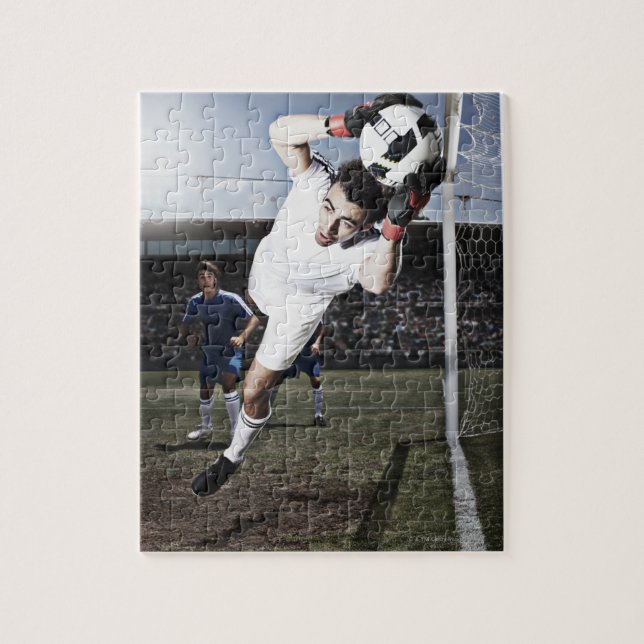 Soccer goalie catching soccer ball jigsaw puzzle (Vertical)