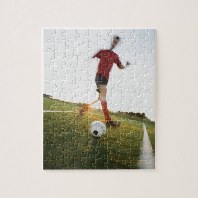 Soccer player dribbling ball jigsaw puzzle (Vertical)