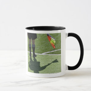 Soccer referee holding flag. mug