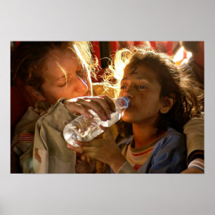 Soldier Helping a Refugee Child Poster