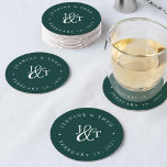 Solid Hunter Green Wedding Monogram Round Paper Coaster<br><div class="desc">Solid hunter green coasters for your wedding cocktail hour or reception feature your initials worked into a monogram design,  joined by a decorative script ampersand. Your names and wedding date appear in white lettering,  curved around the outside. Designed to coordinate with our Timber Grove wedding invitation collection.</div>