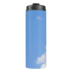 Solitary Bird Soaring Through Bright Blue Sky with Thermal Tumbler