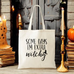 Some Days I'm Extra Witchy Modern Womens Halloween<br><div class="desc">Add a touch of sass to your style with our "Some Days I'm Extra Witchy" Modern Women's Halloween Tote Bag! This chic black tote features the playful phrase in elegant, modern typography, perfect for expressing your witchy side. Made from durable materials, it’s spacious enough for all your daily essentials, whether...</div>