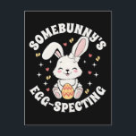 Somebunnys Egg-specting Pregnancy Announcement |  Postcard<br><div class="desc">Hop into the season with this adorable "Somebunny's Egg-specting" design! Perfect for a spring pregnancy announcement, this charming illustration features a sweet bunny silhouette, pastel Easter eggs, and festive spring florals. Whether you are creating a digital social media reveal, a custom t-shirt for Easter brunch, or a memorable keepsake card...</div>