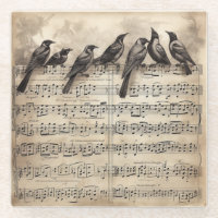 song birds sitting on a musical composition