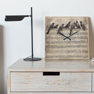 song birds sitting on a musical composition square wall clock