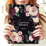 Sophisticated Dark Floral Custom Name Planner<br><div class="desc">This elegant design showcases a luxurious arrangement of florals in rich plum, cream, blush, and navy tones, set against a dramatic black background. The personalised name and year add a refined and unique touch, perfect for professionals, students, or anyone who loves classic and timeless floral art. Ideal for organising tasks,...</div>