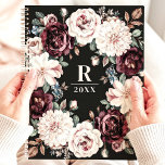 Sophisticated Dark Moody Floral Monogram Planner<br><div class="desc">This elegant design features a sophisticated floral wreath with rich blooms in shades of burgundy, blush, and cream, accented with soft greenery and berries. The dark black background enhances the timeless beauty of the arrangement, while the customisable monogram and year add a personal touch. Perfect for professionals, students, or anyone...</div>