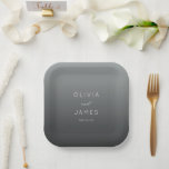 Sophisticated Gray Minimalist Wedding Paper Plate<br><div class="desc">This elegant wedding plate features a minimalist design with a gradient gray background that transitions from light to dark. The layout is centered, showcasing bold, uppercase names in a clean sans-serif font, complemented by a stylish cursive "and" for added sophistication. Below the names, the date is presented in a lighter...</div>
