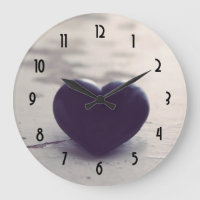 Soulful Purple Stone Heart on a Sandy Beach
