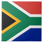 South African Flag Tile<br><div class="desc">Enhance your living space with our stunning tile featuring the flag of South Africa! Crafted with meticulous attention to detail, this tile proudly showcases the iconic flag of South Africa. The flag features horizontal bands of green, gold, black, white, red, and blue with a Y-shaped green band at the centre....</div>