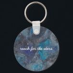 Space Explorer Key Ring<br><div class="desc">This inspirational keychain,  featuring a hand-painted galaxy filled with stars and planets ad featuring the phrase "reach for the stars" makes a wonderful gift. Text is fully customisable. Part of a collection from Parcel Studios.</div>