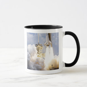 Space Shuttle Atlantis lifts off Mug
