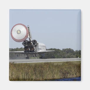 Space shuttle Atlantis unfurls its drag chute 3 Magnet