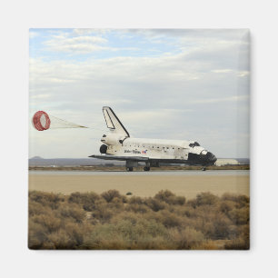 Space Shuttle Discovery deploys its drag chute Magnet