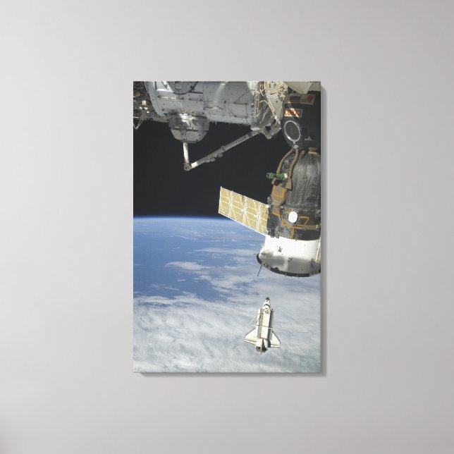 Space shuttle Endeavour, a Soyuz spacecraft Canvas Print (Front)