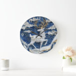 Sparkling Reindeer Christmas Joy Large Clock<br><div class="desc">A stunning handmade clock features a majestic reindeer with golden antlers,  set against a rich blue backdrop. The wintry scene captures swirling clouds and hints of movement,  highlighting the artistry of the design. It's perfect for holiday decor.</div>