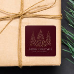 Sparkling Winter Pine Burgundy Merry Christmas Square Sticker<br><div class="desc">Elegant Christmas stickers featuring snowy faux gold foil pine trees with a burgundy background (or colour of your choice). "Merry Christmas" is displayed in a white, modern serif font with your name or custom text below. The personalised holiday stickers are perfect to use for sealing Christmas card envelopes, gift wrapping,...</div>