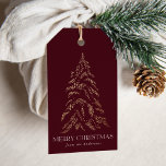 Sparkling Winter Pine Merry Christmas Gift Tags<br><div class="desc">Modern and elegant holiday gift tags featuring a snowy faux gold foil pine tree with a burgundy background (or colour of your choice). "Merry Christmas" is displayed in a white,  modern serif font with your name or custom text below.</div>