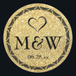 Sparkly Gold Monogram Wedding Favour Stickers Seal<br><div class="desc">Round faux gold glitter and black monogram wedding favour stickers. Cute open black heart with monogrammed initials of bride and groom plus the date of their marriage. Personalised thank you stickers or luxurious envelop seals or stickers. Elegant typography and chic black and gold border that has hints of Art Deco...</div>
