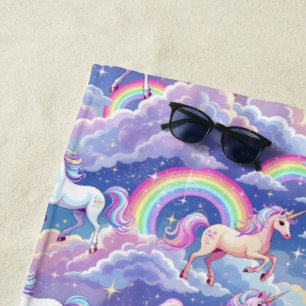 Sparkly rainbow and unicorns on clouds beach towel