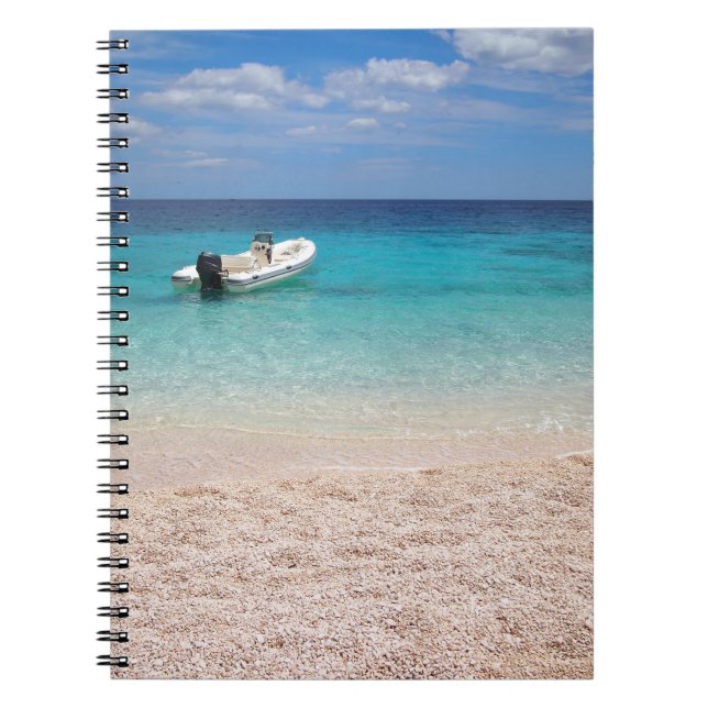 Speedboat in the blue sea notebook (Front)