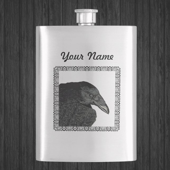 Spooky Black Crow Raven Face Hip Flask (Head shoulders of Gothic black crow in ornate black frame on silver drinking flask.)