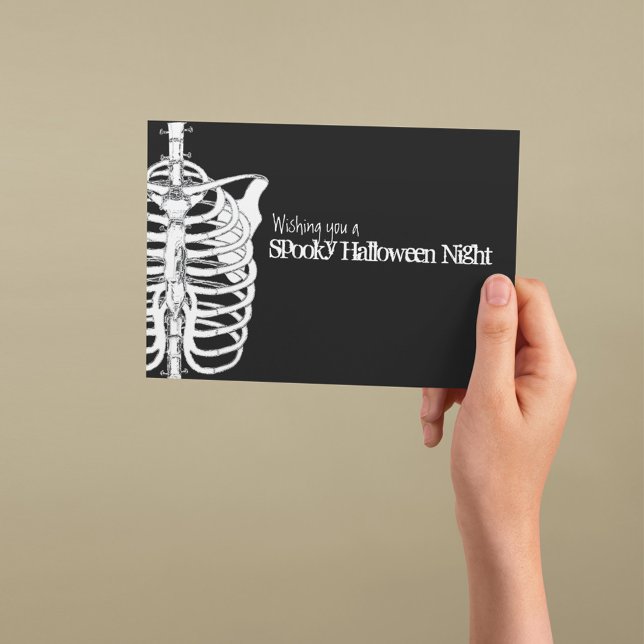 Spooky Skeleton X-Ray Halloween Card (Spooky Halloween greeting card with skeleton illustration and gothic black background.)